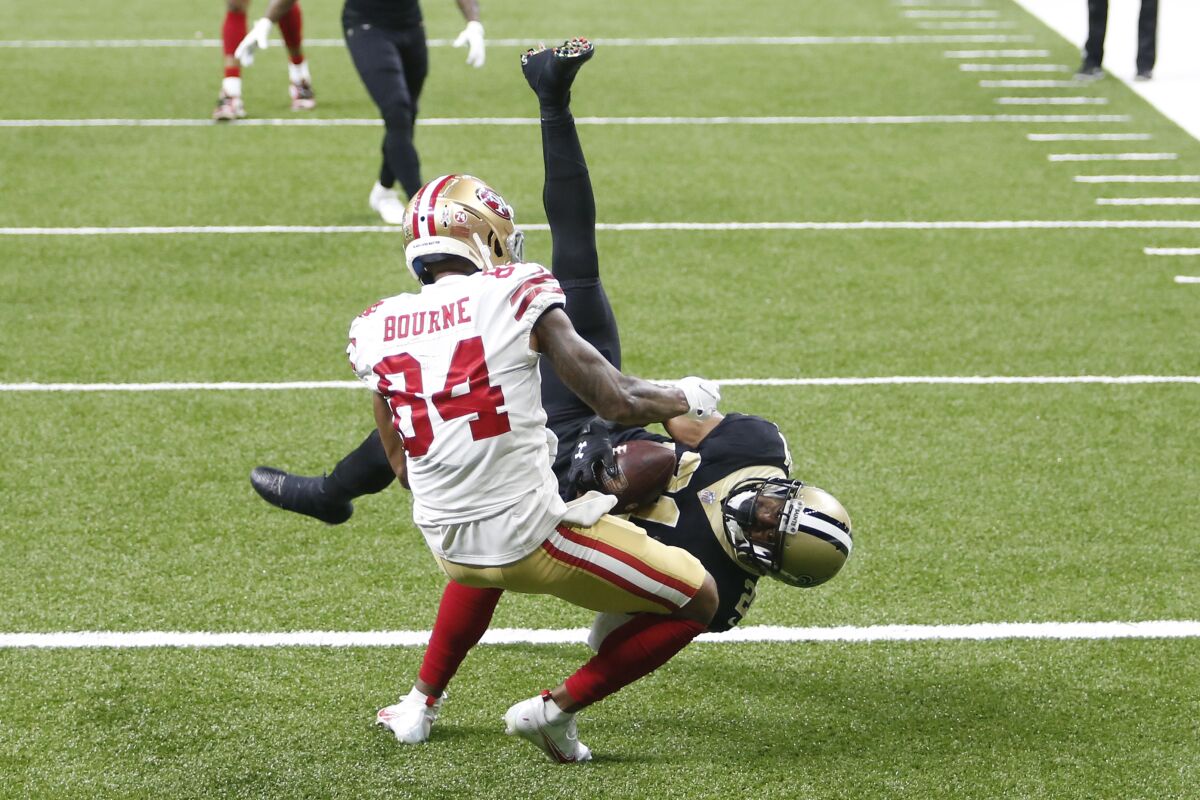 New Orleans Saints cornerback Patrick Robinson intercepts a pass intended for San Francisco 49ers wide receiver Kendrick Bourne (84) in the second half of an NFL football game in New Orleans, Sunday, Nov. 15, 2020. The Saints won 27-13. (AP Photo/Brett Duke)