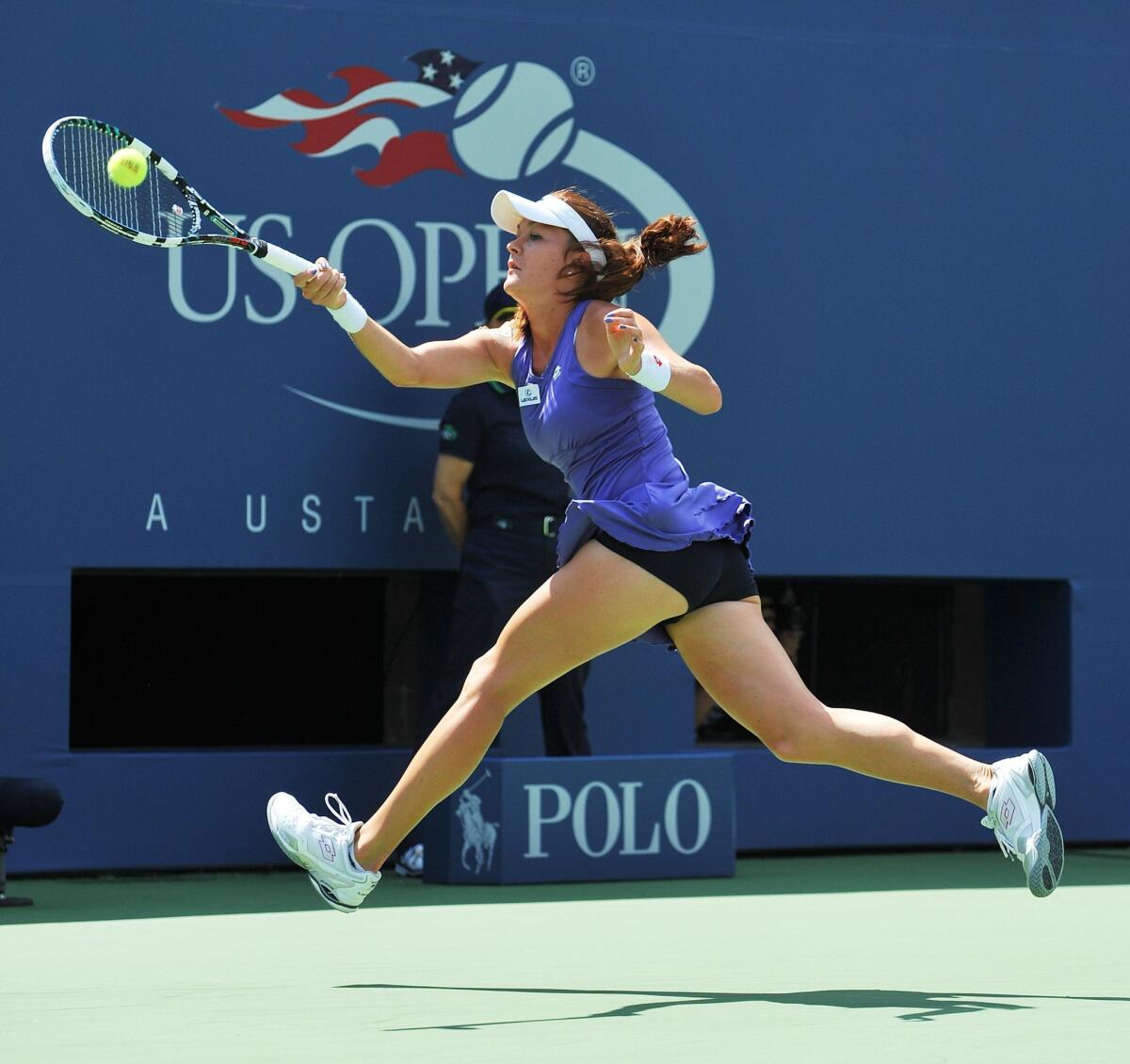 Agnieszka Radwanska hits a return to Nina Bratchikova during their match on the second day of the U.S. Open.