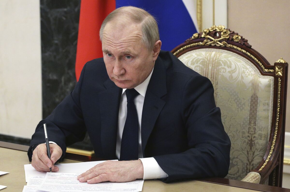 FILE - Russian President Vladimir Putin chairs a meeting with members of the government via teleconference in Moscow, Thursday, March 10, 2022. (Mikhail Klimentyev, Sputnik, Kremlin Pool Photo via AP, File)