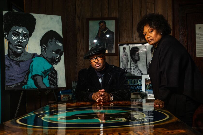 MAYWOOD, ILLINOIS: Fred Hampton, Jr., left, son of Fred Hampton, a Black Panthers leader killed by police in 1969, poses Tuesday, Feb. 2, 2021 with his mother Akua Njeri at Hampton House in Maywood, Ill. Hampton House was the boyhood home of Fred Hampton. (Photo by Chris Walker/For The Times)