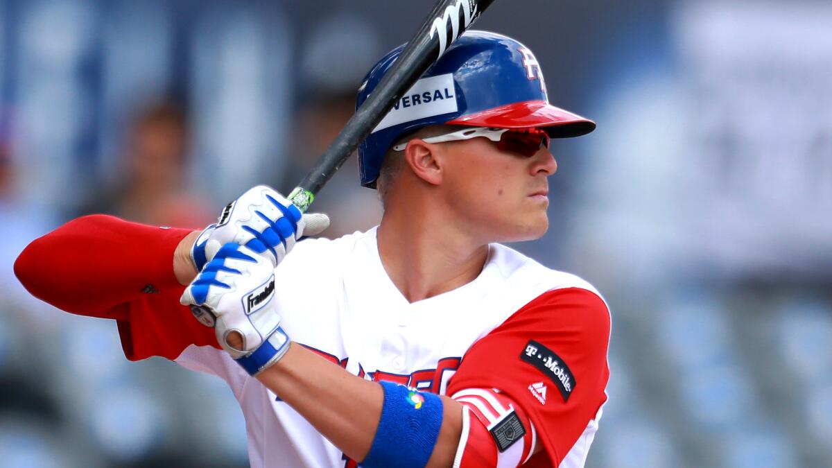 Enrique Hernandez, who started for Puerto Rico in the World Baseball Classic, is fighting for a spot on the Dodgers' opening-day roster. (Miguel Tovar / Getty Images)