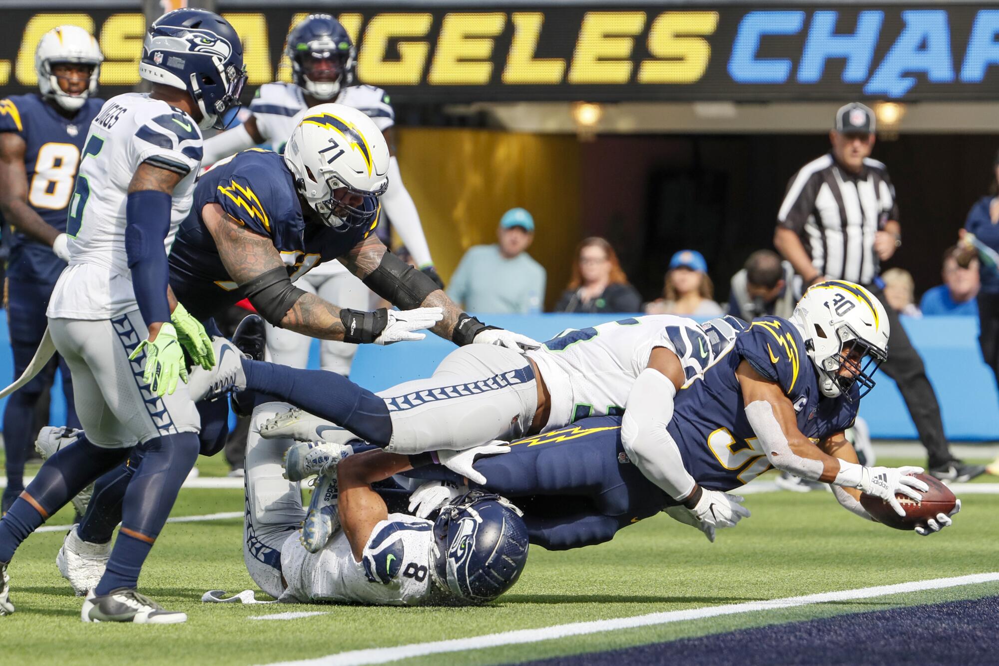 Chargers running back Austin Ekeler dives into the end zone for a first-half touchdown.