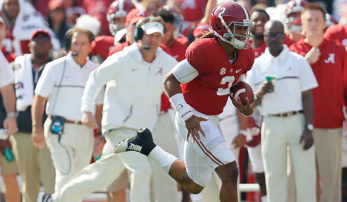 Alabama quarterback Jalen Hurts rushes against Mississippi State on Saturday.