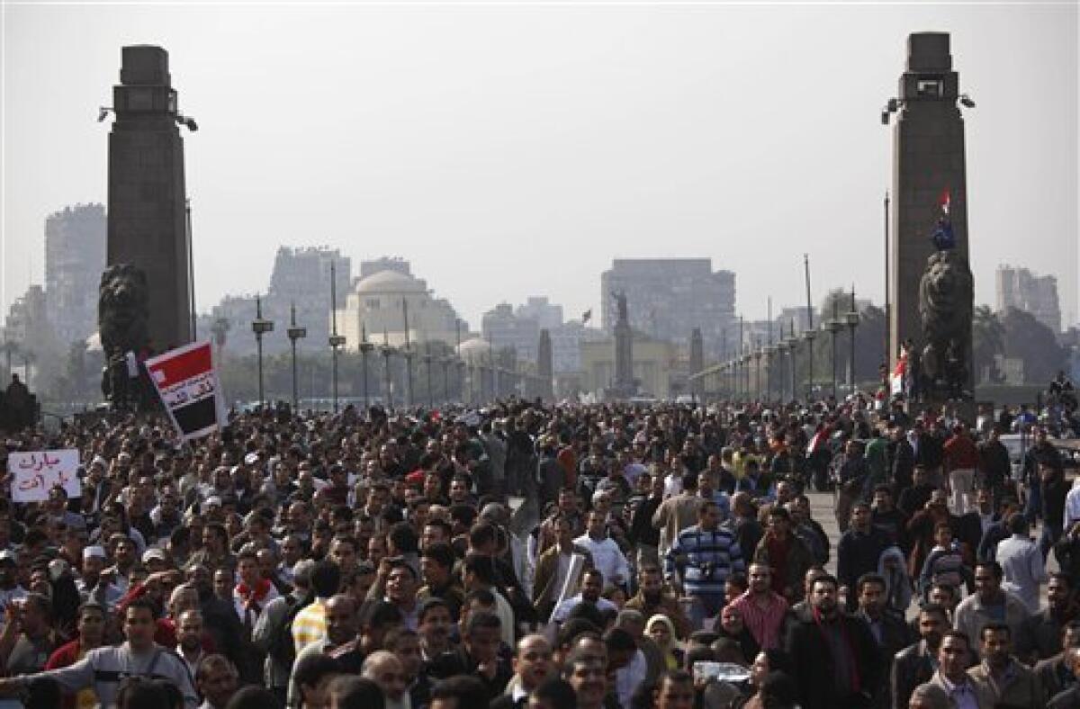 A huge crowd crosses a bridge over the Nile river, on their way to Tahrir or Liberation Square in Cairo, Egypt, Tuesday, Feb. 1, 2011. More than a quarter-million people flooded into the heart of Cairo Tuesday, filling the city's main square in by far the largest demonstration in a week of unceasing demands for President Hosni Mubarak to leave after nearly 30 years in power. (AP Photo/Emilio Morenatti)