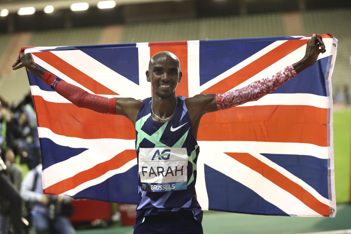 Britain's Mo Farah celebrates after winning a Diamond League race in Brussels on Sept. 4, 2020. 