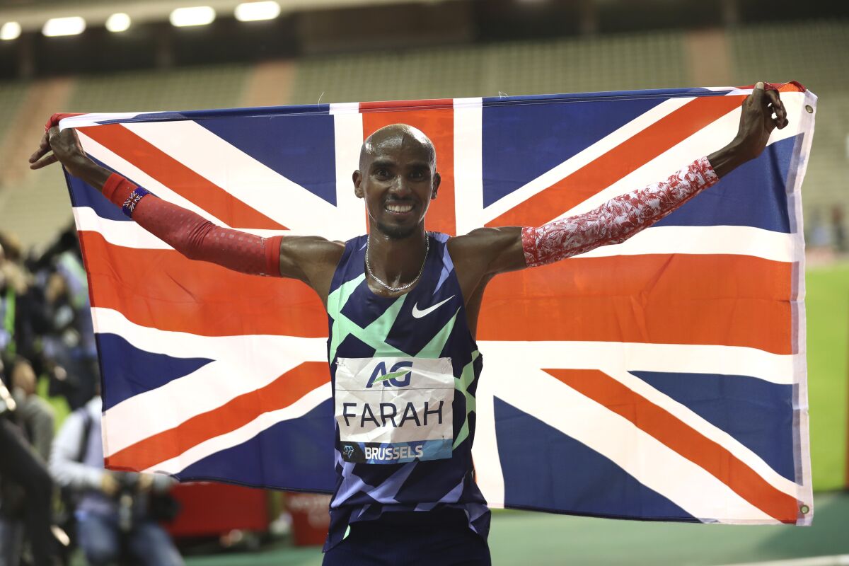 Britain's Mo Farah celebrates after winning a Diamond League race in Brussels on Sept. 4, 2020.
