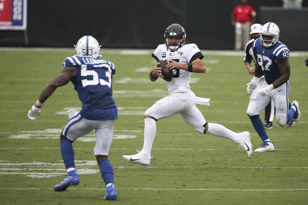 Jacksonville Jaguars quarterback Gardner Minshew, center, scrambles for yards against the Indianapolis Colts on Sunday.