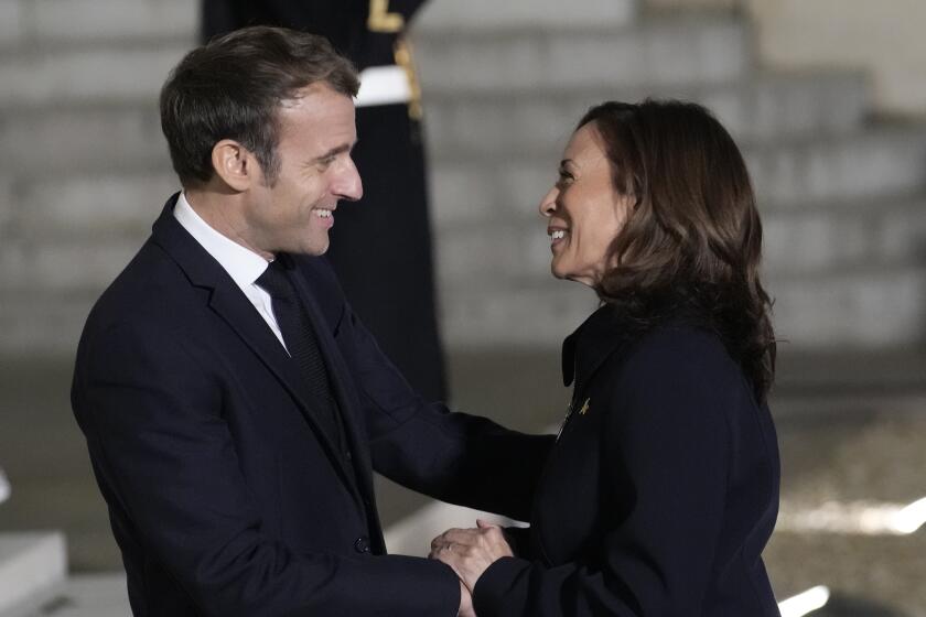 French President Emmanuel Macron welcomes Vice President Kamala Harris Wednesday, Nov. 10, 2021 at the Elysee Palace in Paris. Kamala Harris will try to smooth French feathers after a diplomatic crisis. The U.S.-France relationship hit a historic low this year after a U.S.-British submarine deal with Australia scuttled a French contract to sell subs to the Australian navy. (AP Photo/Christophe Ena)