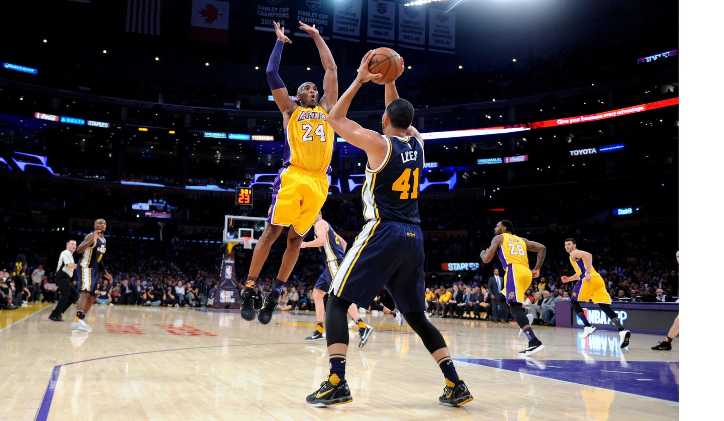Kobe Bryant tries to steal the ball in his last game as a Laker at the Staples Center Wednesday, April 12.