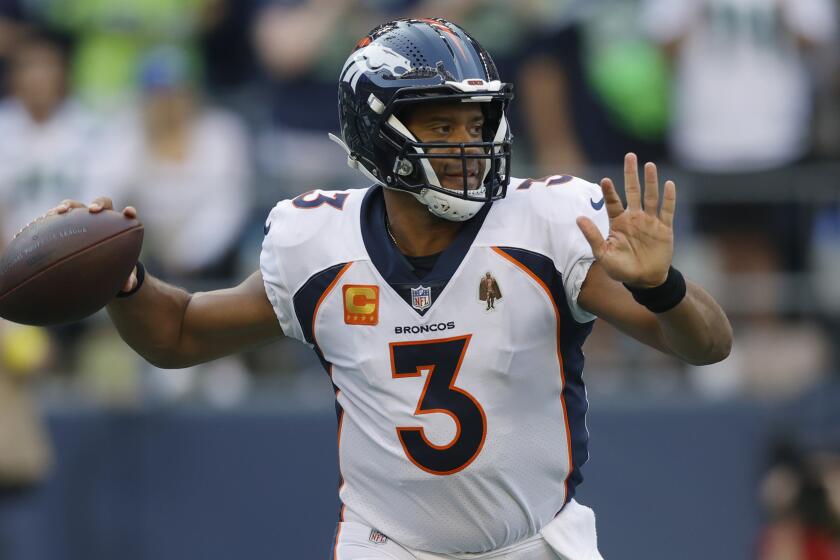 Denver Broncos quarterback Russell Wilson passes against the Seattle Seahawks on Sept. 12, 2022.