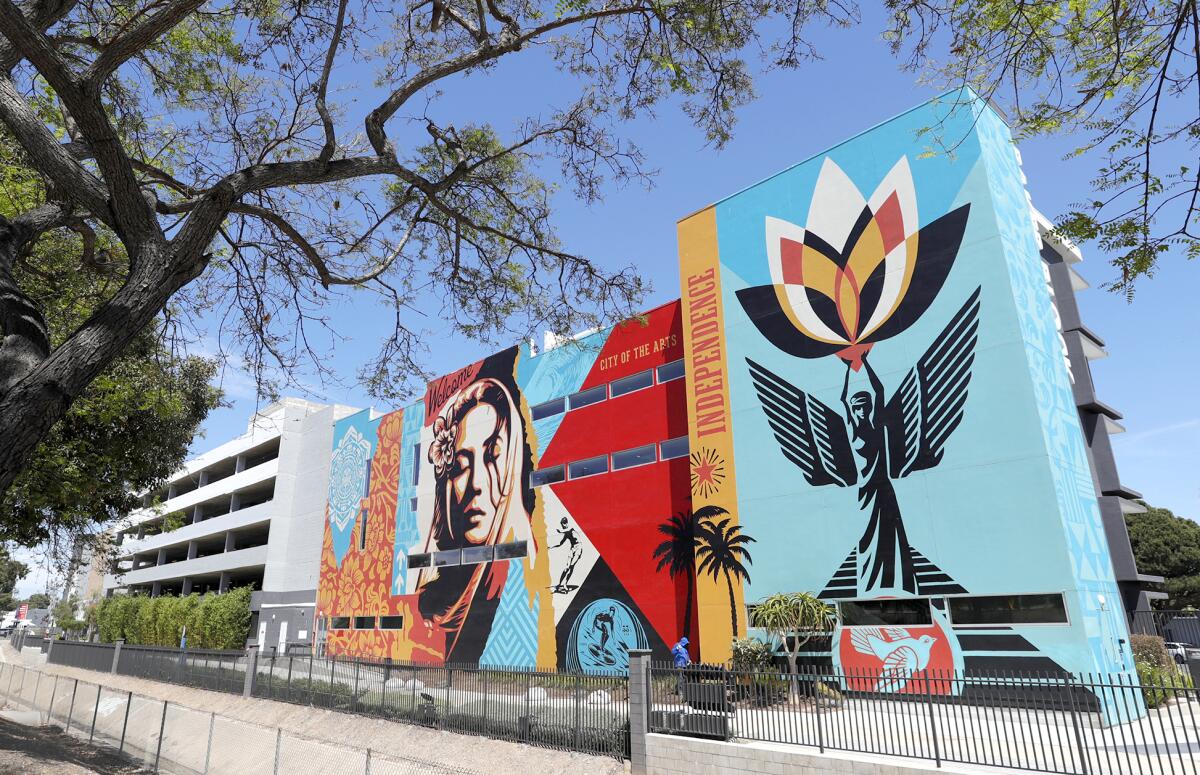 Shepard Fairey's "Welcome Home" mural on Costa Mesa's Baker Block apartments is one of many public art pieces.
