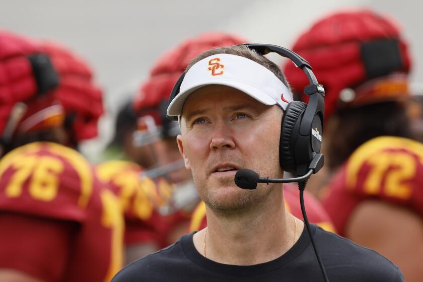 USC coach Lincoln Riley looks up and across the field during the Trojans' spring game at the Coliseum on April 20.