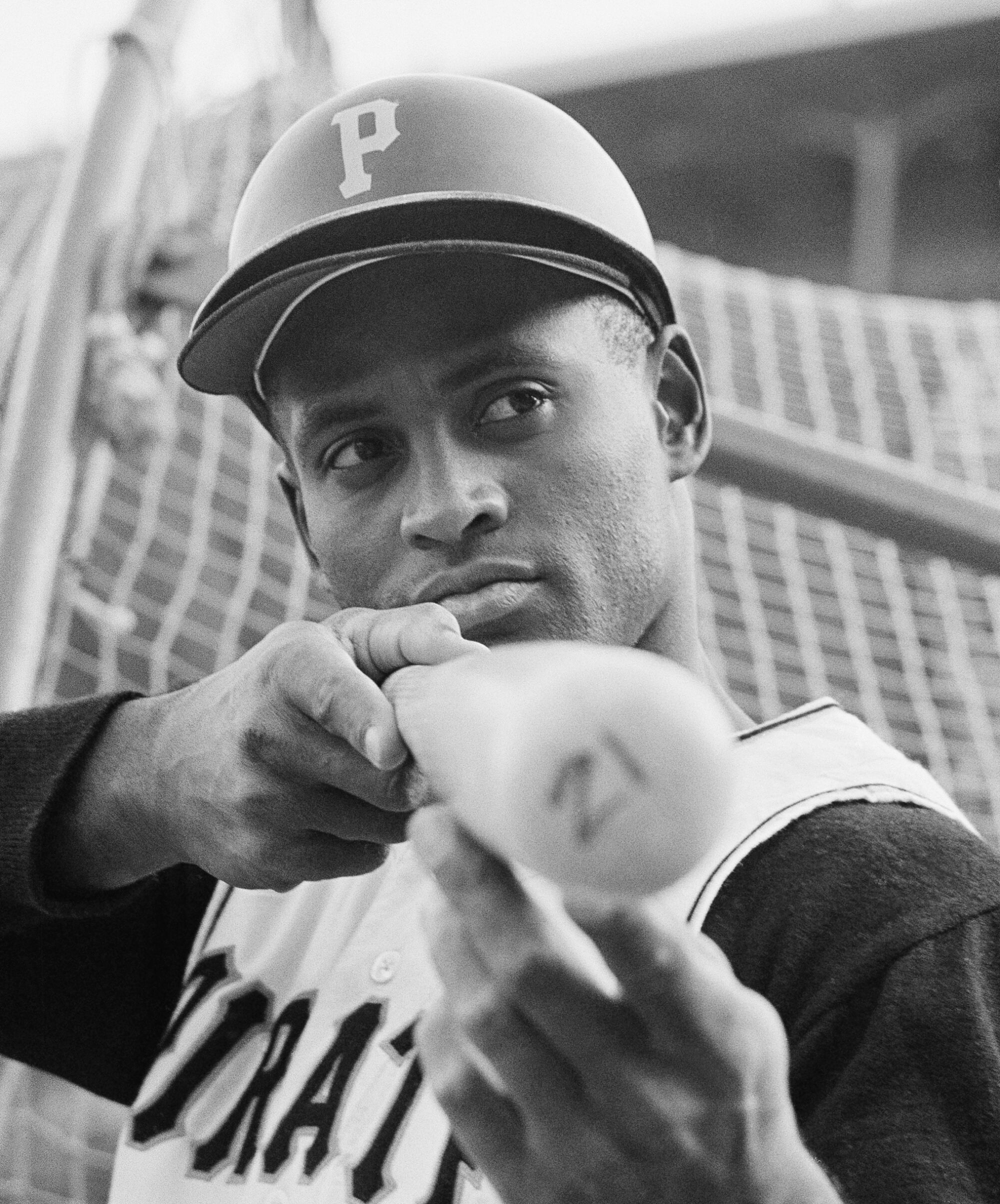 Roberto Clemente of the Pittsburgh, Prates Baseball team looks down a bat