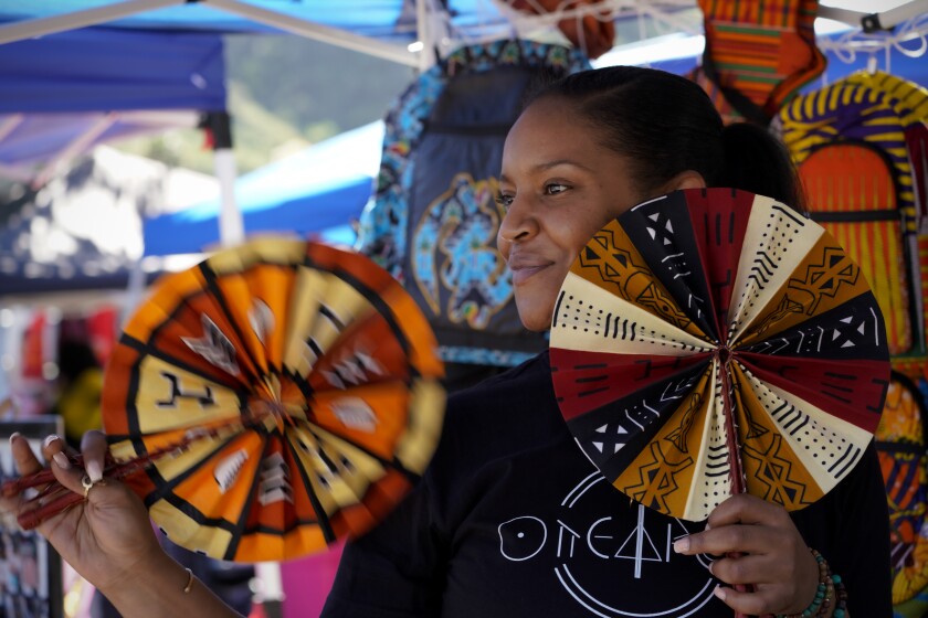 Kay Black owner of one1Africa showed off her fans for sale at the Soul Swapmeet at Westfield Mission Valley.
