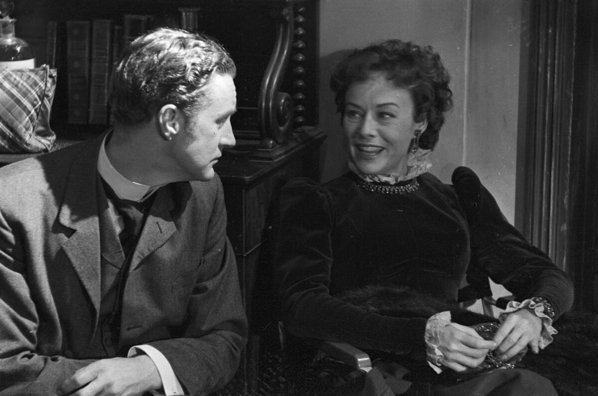 Ronald Howard, left, as Sherlock Holmes and Paulette Goddard as Lady Nina Beryl in the 1950s series "Sherlock Holmes."