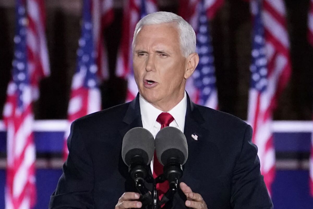 Vice President Mike Pence speaks into microphones