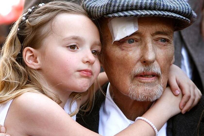 Actor Dennis Hopper hugs his 7-year-old daughter Galen on Friday morning as he receives the 2,403th star on Hollywood's Walk of Fame.