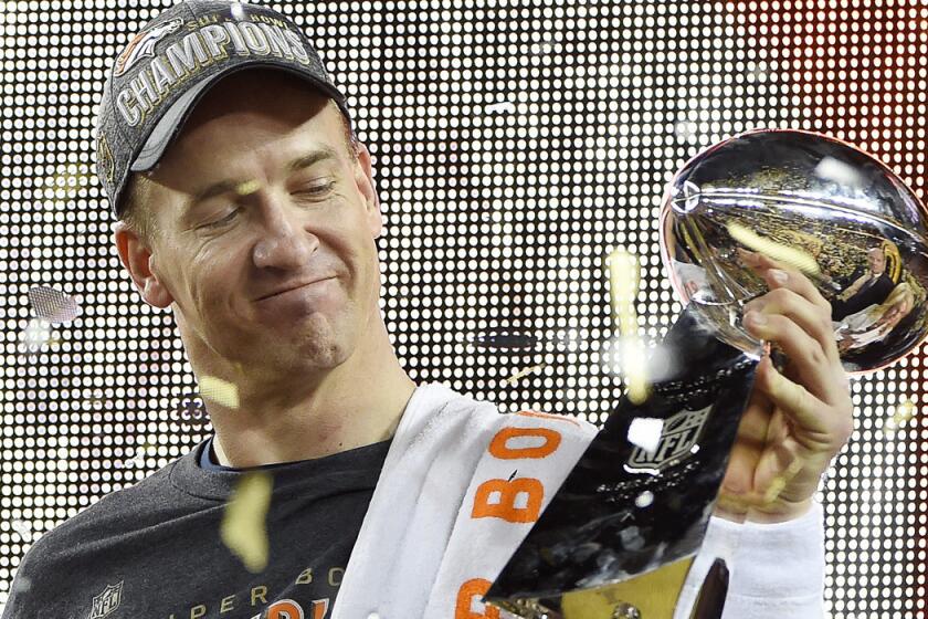 Denver Broncos quarterback Peyton Manning holds the Vince Lombardi trophy after winning Super Bowl 50 against the Carolina Panthers on Feb. 7.