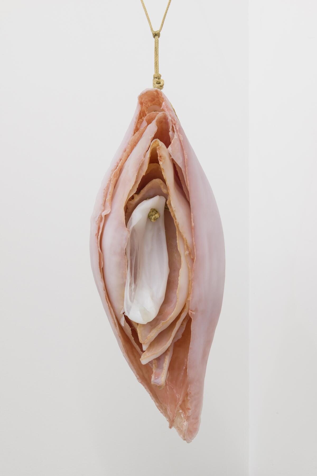 "Eat Me," a shell and flower petal-like sculpture by Kelly Akashi.