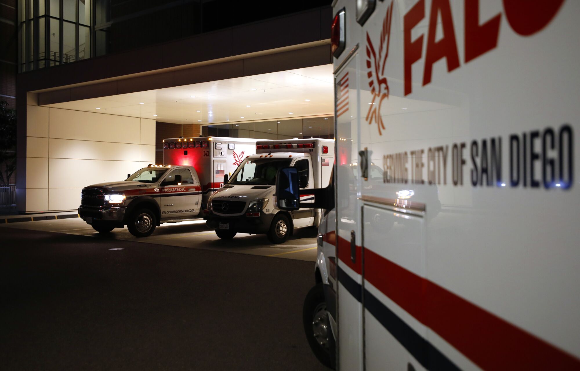 Ambulances are lined up at the emergency room at Scripps Memorial Hospital La Jolla on Monday.