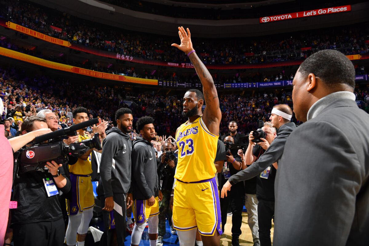 LeBron James acknowledges the fans’ ovation after passing Kobe Bryant on the NBA’s all-time scoring list.