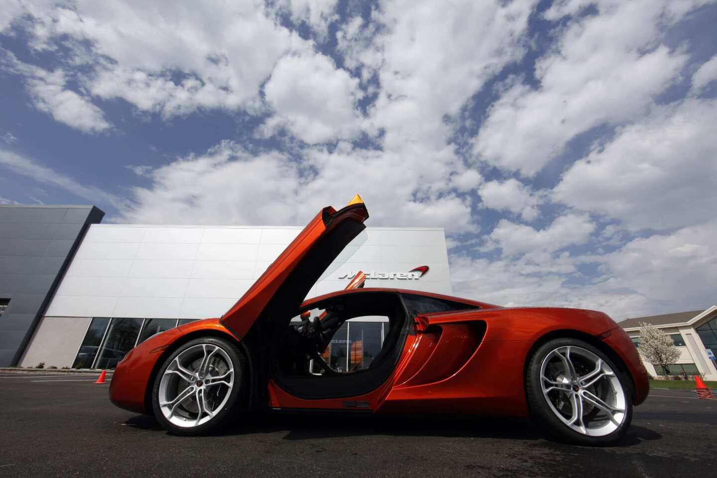 The McLaren MP4-12C is an all-new, mid-engined, rear-wheel-drive car. Above, a 12C at a dealership in West Chester, Pa.