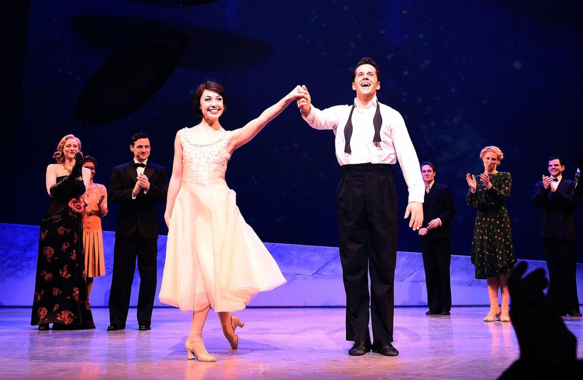 "An American in Paris" cast members take a curtain call after the opening night performance at the Palace Theater in New York on Sunday. The modernized version of the 1951 Oscar-winning film tells of the romance between a beguiling French waitress and a former American soldier working to rebuild their lives after World War II.
