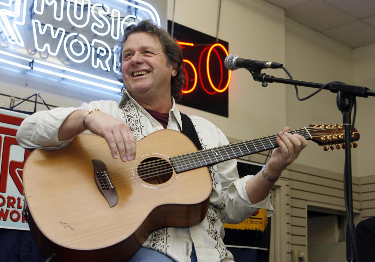 John Wetton performs with the band Asia at a music store in New York on April 17, 2008.