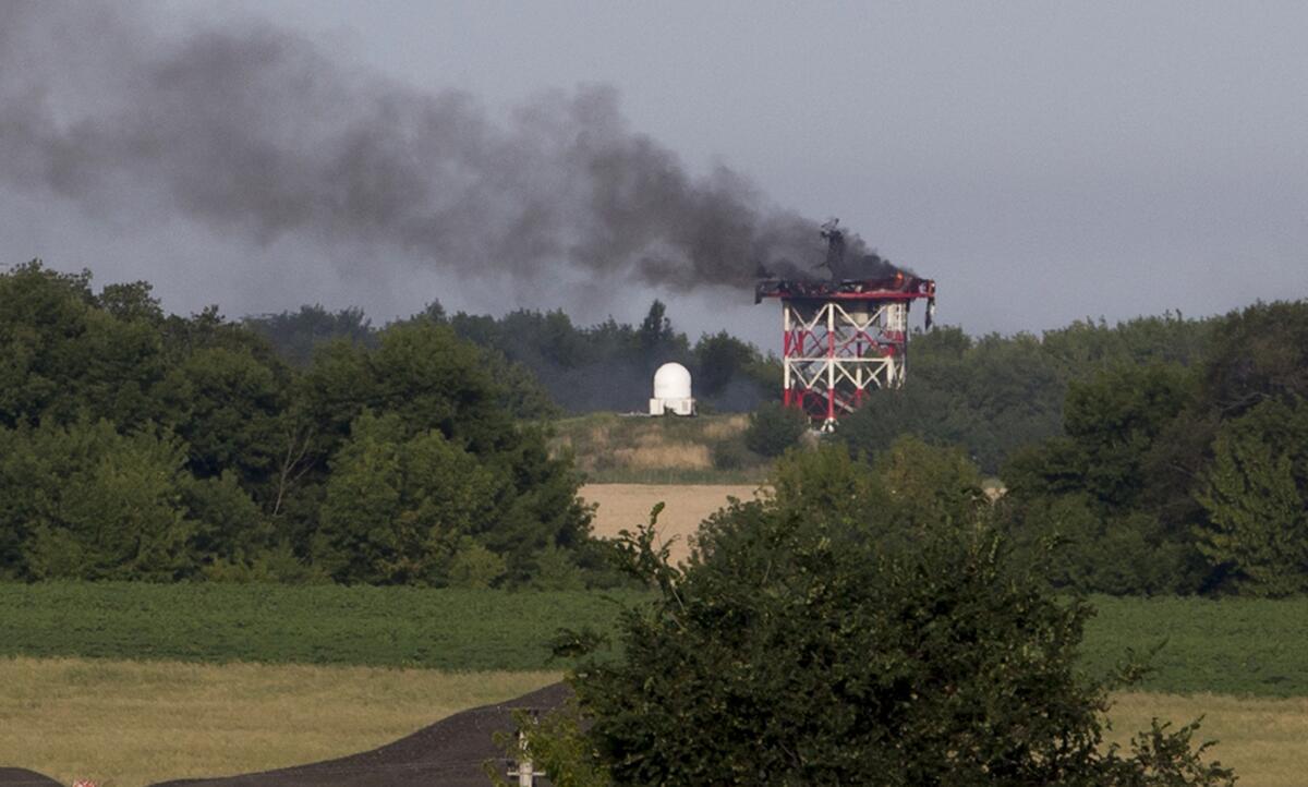 A radar tower burns after fighting in recent days between pro-Russia militants and Ukrainian government forces near Sergei Prokofiev International Airport in Donetsk, in eastern Ukraine.