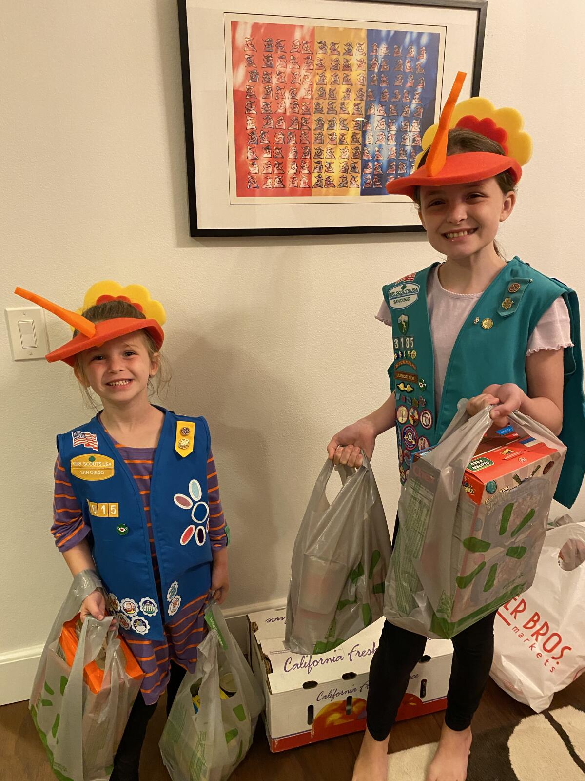 Troop leader Christie Swiss’ daughters enjoy working on a Girl Scout project.