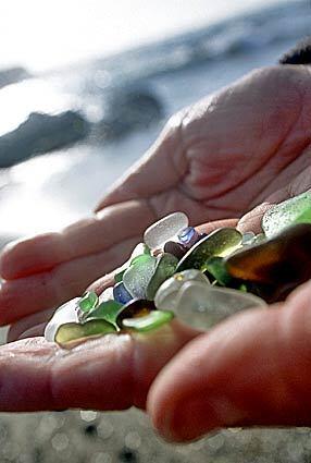 Glass beach is in Fort Bragg, the scruffier northern neighbor of Mendocino, at the west end of Elm Street, of Old Haul Road. At first glance it looks like a standard-issue beach. But look at that twinkly stuff underfoot: silvery, green, blue, orange and occasionally red bits of ground glass, twinkling in the sun and tumbling in the tide along with tons of standard sand, bits of metal, a little kelp.