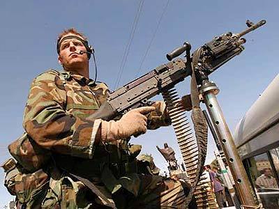 A U.S. special operations soldier mans a machine gun in the strategic northern Iraq oil city of Kirkuk.