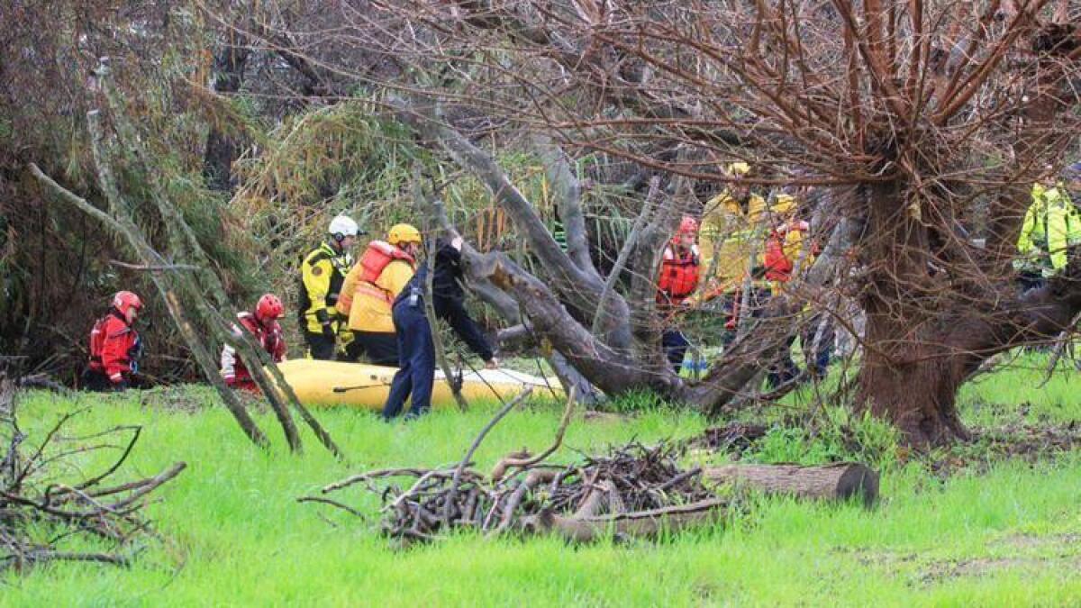 Rescuers recovered the body of a man swept away in his vehicle in Rainbow, Calif.