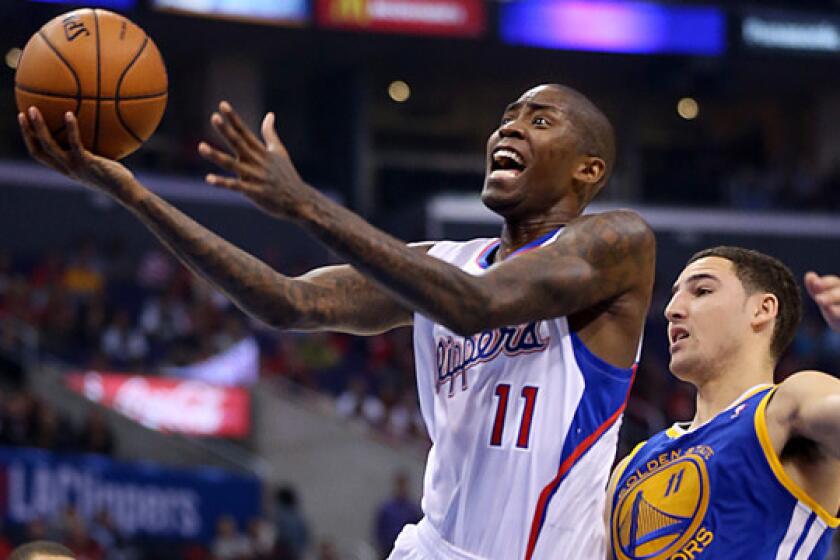 Clippers guard Jamal Crawford puts up a shot in front of Golden State Warriors guard Klay Thompson during a game on Oct. 31.