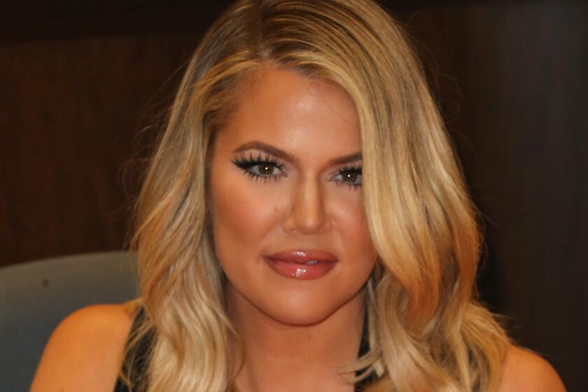Khloe Kardashian signs her book "Strong Looks Better Naked" at an L.A. Barnes & Noble on Nov. 9.