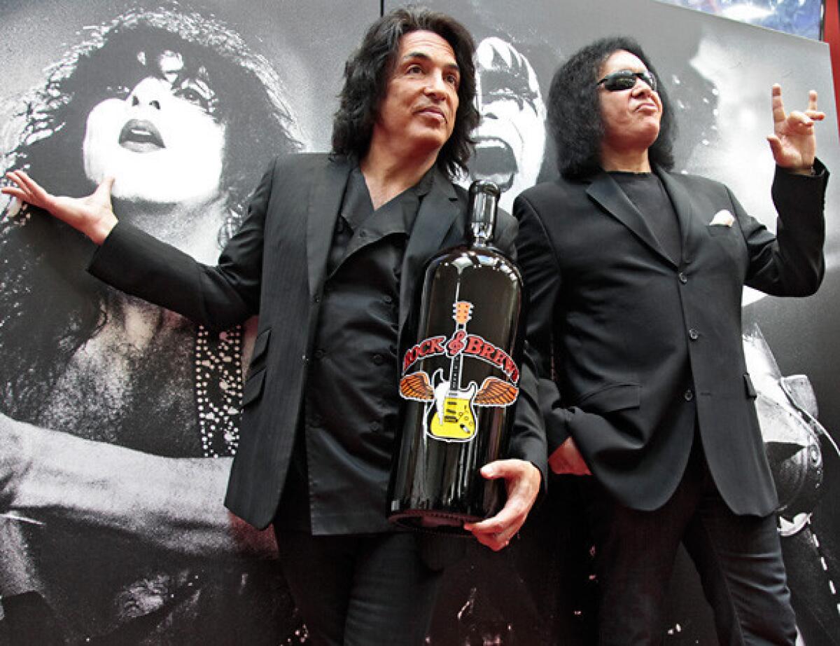 Paul Stanley, left, and Gene Simmons of KISS at the opening of a Rock & Brews restaurant at Los Angeles International Airport in October. They will open a new R&B in Maui at the end of the month.
