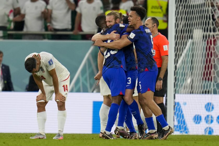 U.S players celebrate after the World Cup group B soccer match between Iran and the United States at the Al Thumama Stadium in Doha, Qatar, Wednesday, Nov. 30, 2022. (AP Photo/Ricardo Mazalan)
