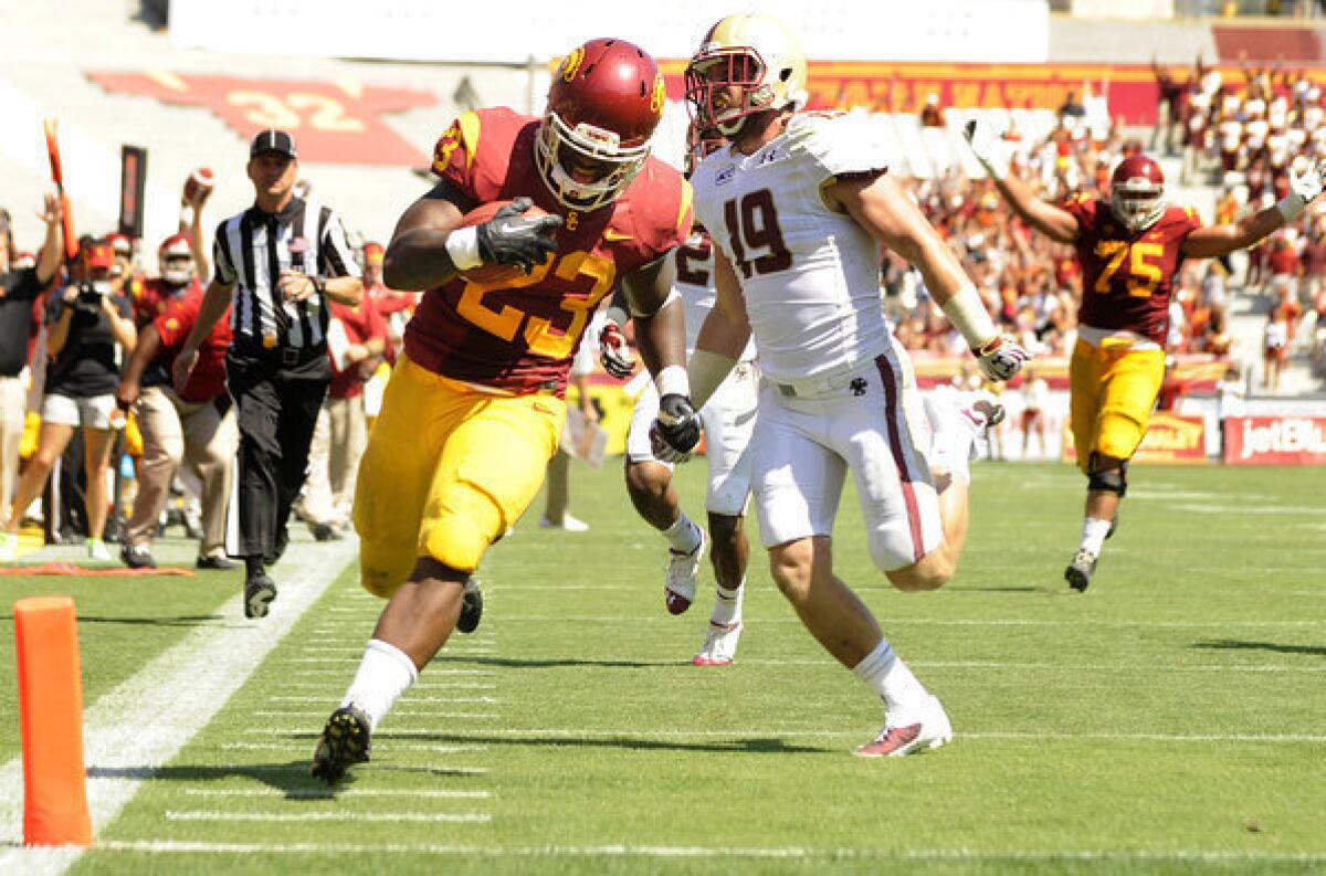 USC running back Tre Madden beats Boston College's Sean Sylvia to the end zone in the third quarter at the Coliseum.
