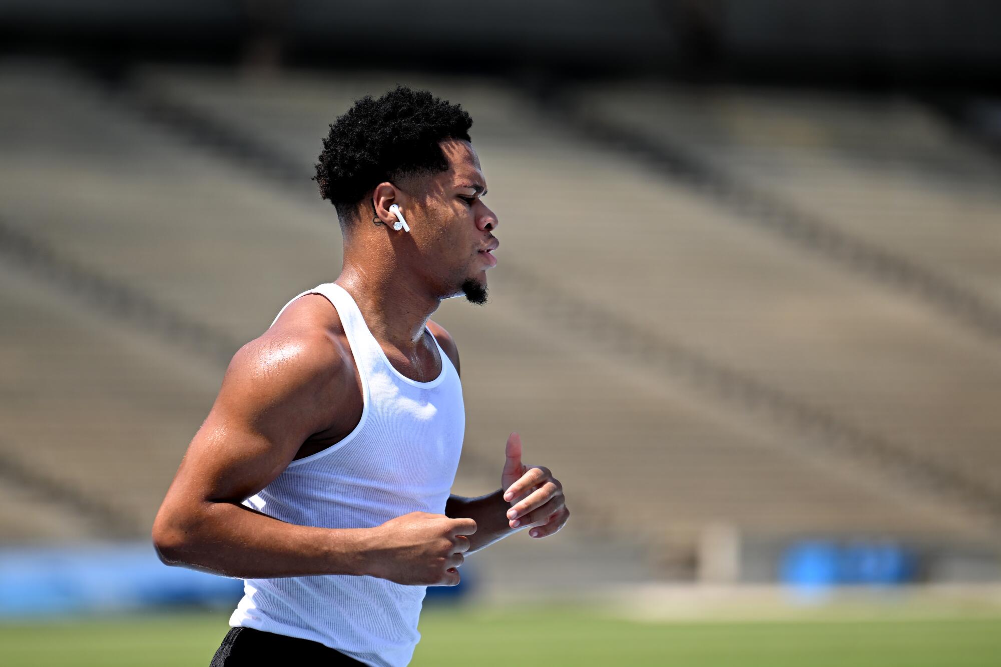 Boxer Devin jogs on the track at Drake Field on the UCLA campus in Los Angeles.