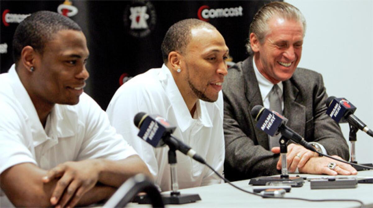 Miami Heat coach Pat Riley, right, has two new building blocks with which to work, forward Shawn Marion, middle, and guard Marcus Banks, both obtained in the O'Neal deal.