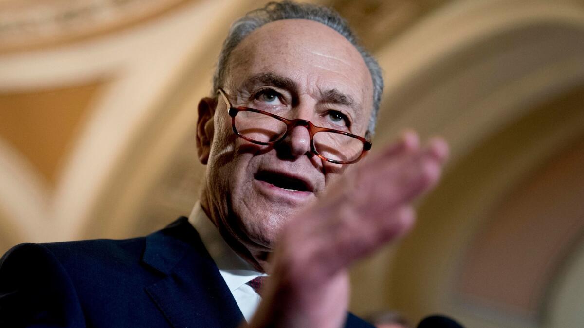 Sen. Charles E. Schumer speaks to reporters Jan. 23 on Capitol Hill.