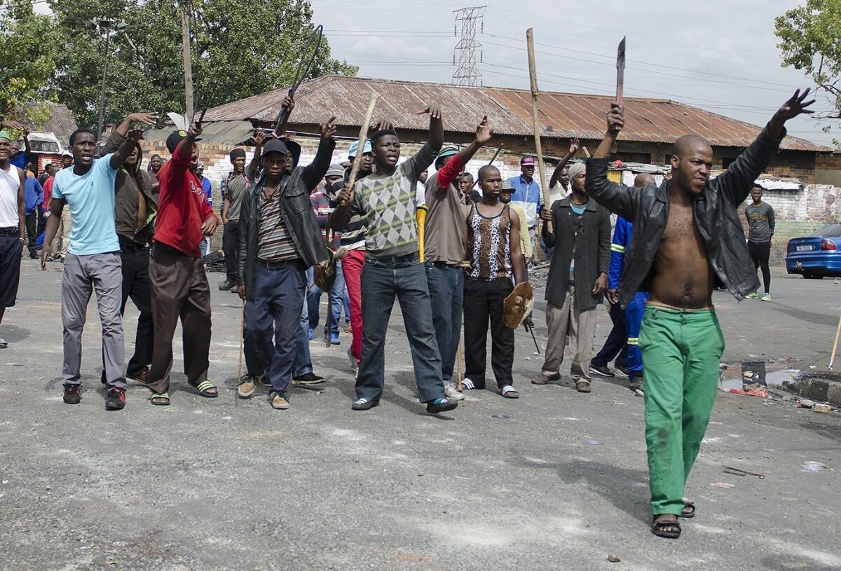 South African hostel dwellers demonstrate against foreigners in Johannesburg on April 17, 2015, after overnight clashes between locals and immigrants in South Africa's largest city.