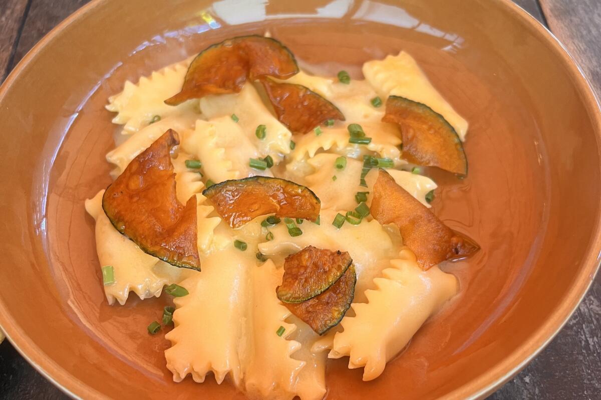 Agnolotti garnished with slivers of zucchini and thyme