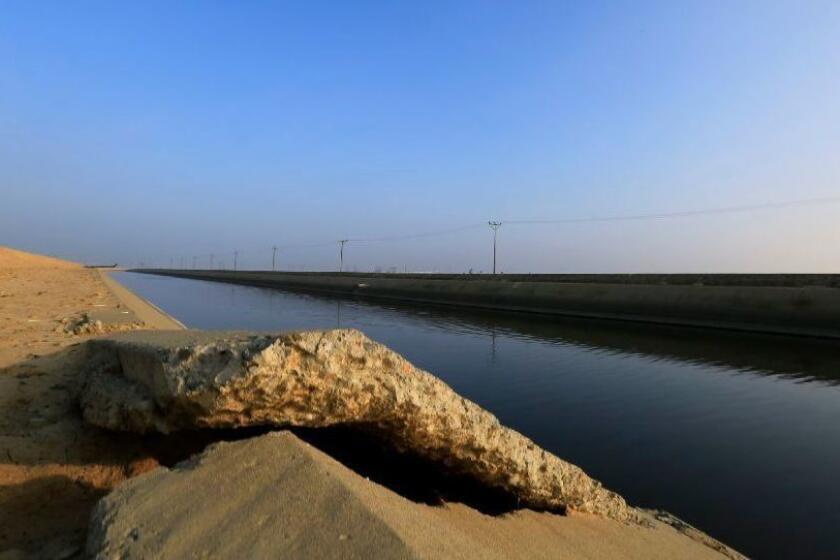 LOS BANOS, CA - JANUARY 13, 2015- USGS Cracked concrete on the Delta Mendota Canal January 13, 2015 near Los Banos. The ground is sinking, maybe irreversibly, due to over pumping groundwater in the San Joaquin Valley. (Brian van der Brug / Los Angeles Times)