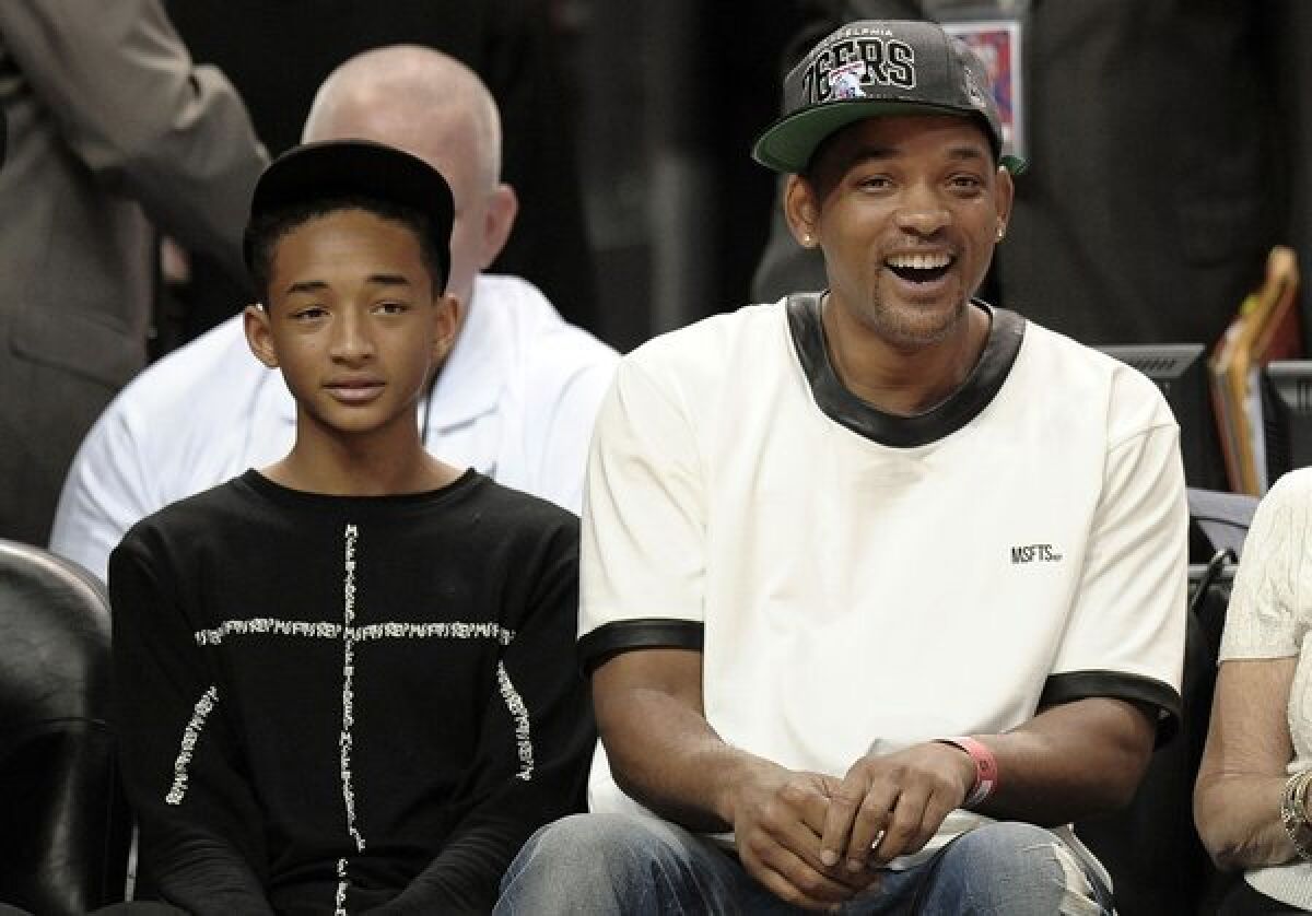 Will Smith and son Jaden get photo-bombed during Game 5 of the NBA Easter Conference Playoffs in Miami.