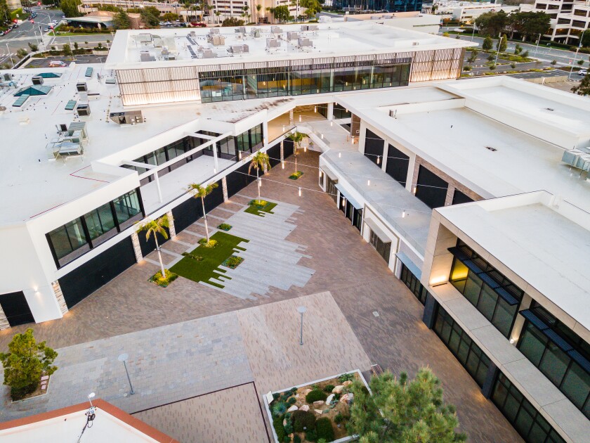 An aerial view of a complex of office buildings.