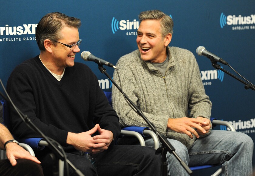 Matt Damon and George Clooney of the cast of "The Monuments Men" answer questions from fans during a SiriusXM "Town Hall" special on SiriusXM's Entertainment Weekly Radio channel at SiriusXM Studio in New York City.