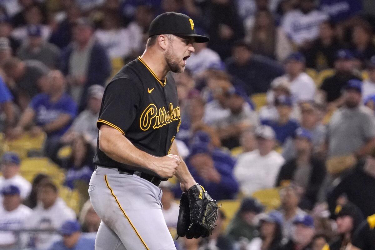 Pittsburgh Pirates starting pitcher Wil Crowe celebrates after Los Angeles Dodgers' Freddie Freeman grounded out to end their baseball game Tuesday, May 31, 2022, in Los Angeles. The Pirates won 5-3. (AP Photo/Mark J. Terrill)
