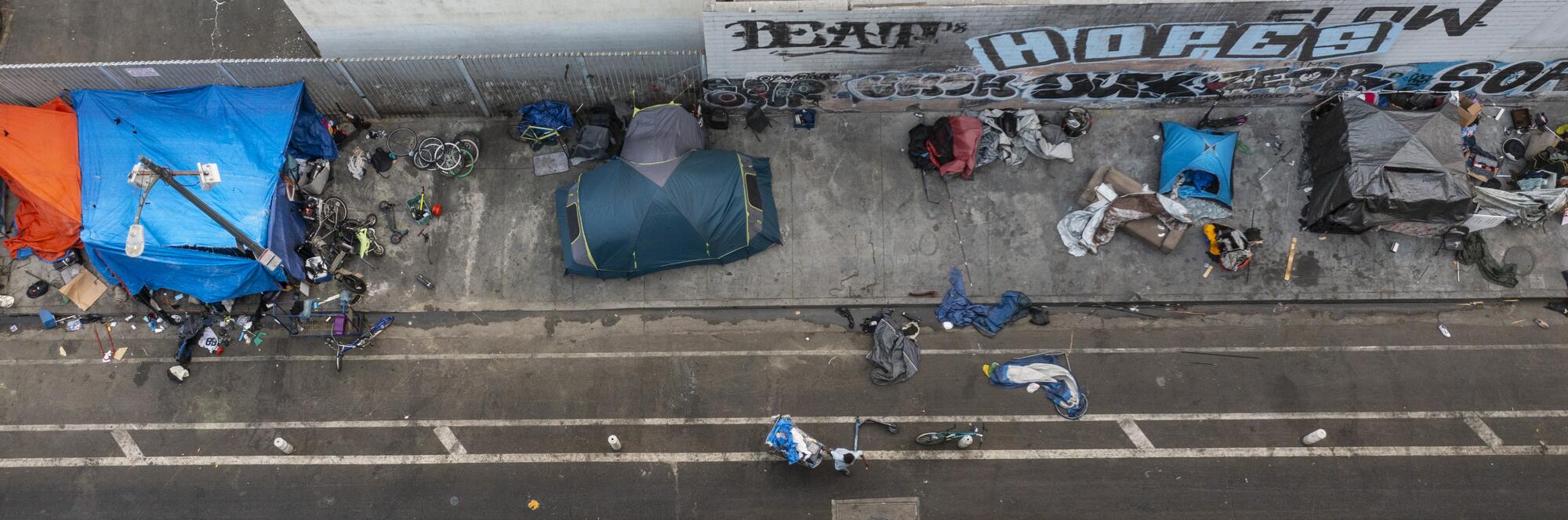 Aerial view of homeless encampments on a sidewalk
