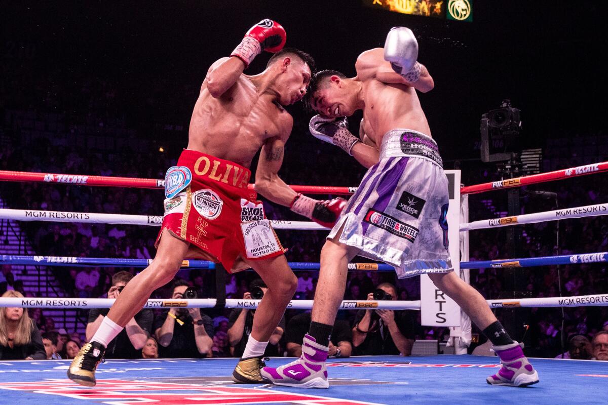  Leo Santa Cruz of Mexico in action against Miguel Floresduring their World Boxing Association world super featherweight championship fight on Saturday in Las Vegas.